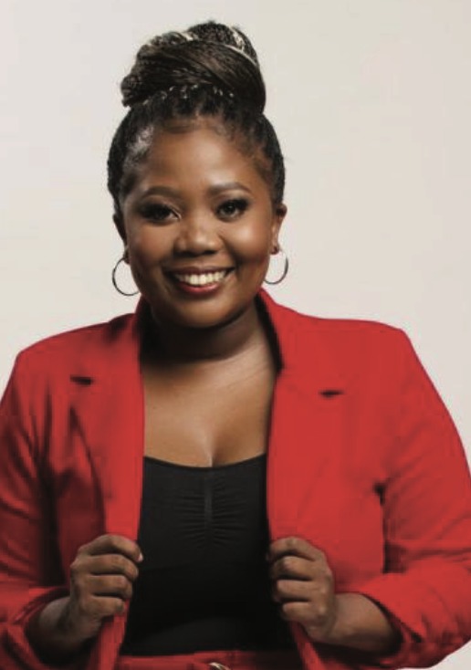 Portrait of Silindelo Sebata wearing a red blazer